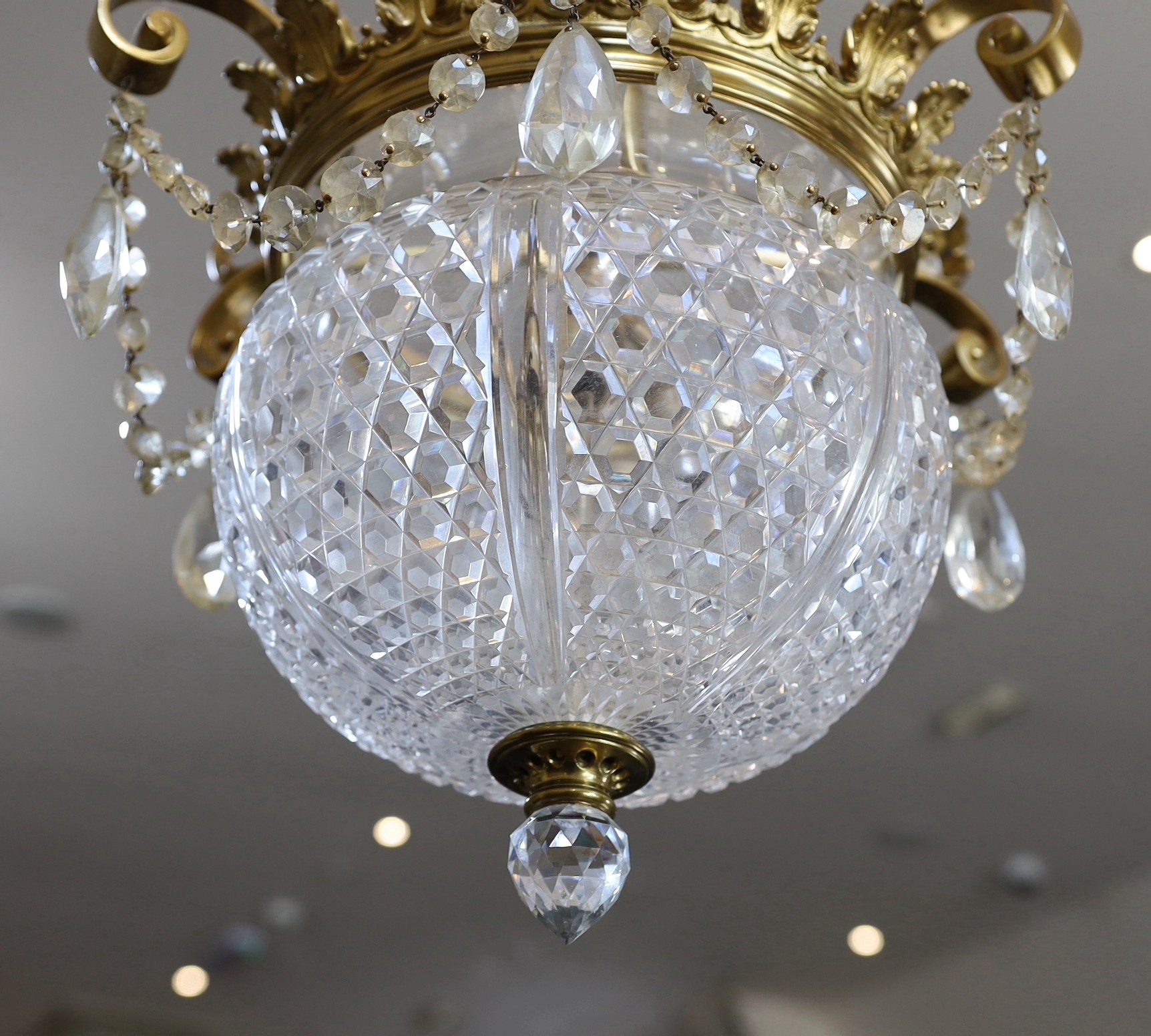 A late Victorian ormolu and cut glass light fitting, by F & C Osler, drop 80cm diameter 36cm